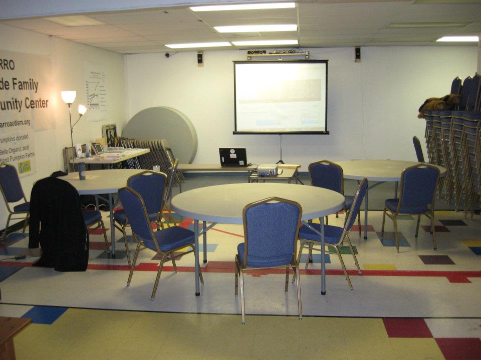 ARROAutism Westside Family and Community Center with tables chairs projector and screen