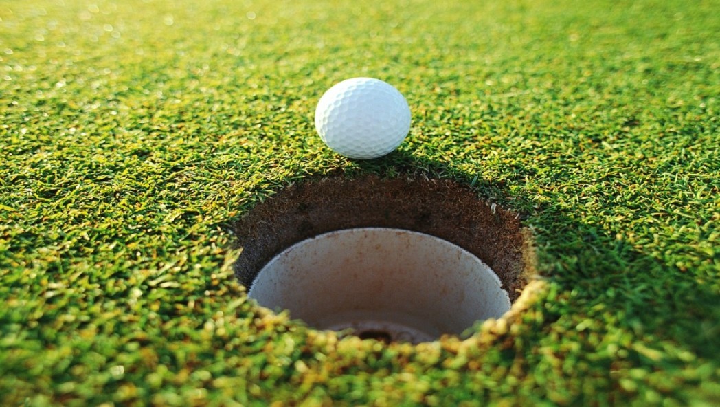 Picture of Golf Ball on edge of hole